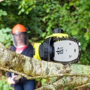 Someone operating a Garden Gear 20V Telescopic Chainsaw